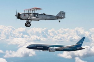 A Boeing Model 40C flies in formation with a new Boeing Dreamliner