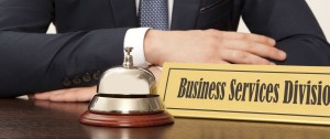 A nameplate with the words Business Services appears with a bell to ring