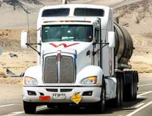 A Kenworth truck, part of Paccar's transportation network, heads down the highway.