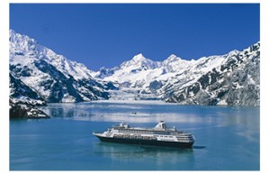 A cruise ship navigates a glacial bay in Alaska