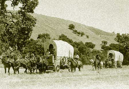 A wagon train heads for Naches Pass, an arduous journey that is the essence of Washington's pioneer spirit.