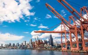 Seattle's port is lined with large cranes to handle international shipments.