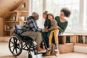 A caregiver interacts with her kids and grandmother in an intergenerational home.