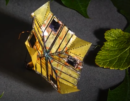 A protoype of a microflier that relies on origami to shape-shift in flight.