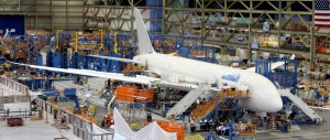 Workers put the finishing touches to a Boeing 787 Dreamliner