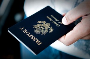A man holds a passport in his hand