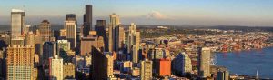 Aerial view of downtown Seattle and Mount Rainier in the distance.