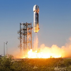 A Blue Origin rocket lifts off from its pad during a test