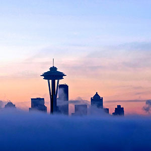 The Seattle skyline, partially obscured by fog