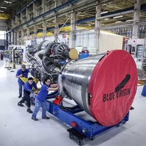 Workers roll out the first BE-4 engine in the Blue Origin Factory in Washington State