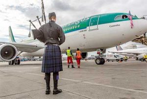 A bag piper welcomes the first scheduled Seattle to Dublin flight to Sea-Tac International Airport