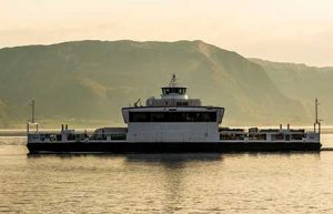 An electrified ferry crosses a fjord in Norway.
