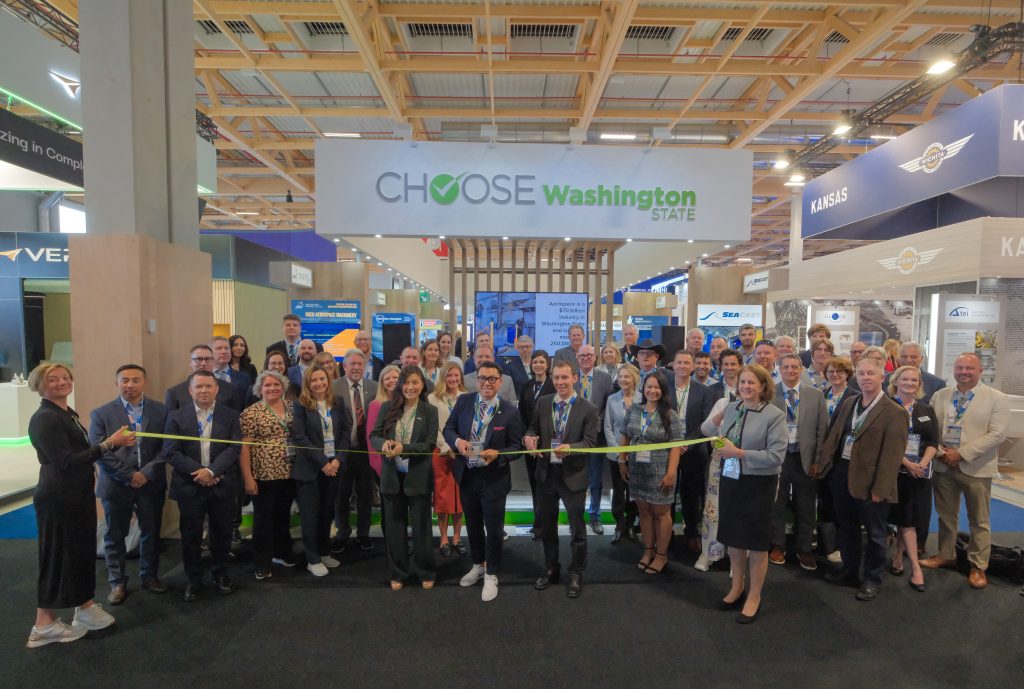Alex Pietsch cuts the ribbon to open the Washington State Pavilion at the 2015 Paris Air Show